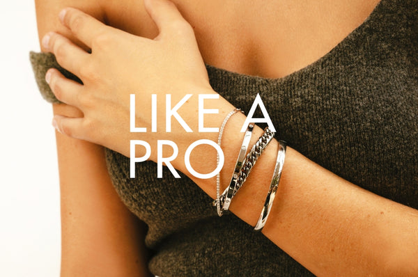 Woman showing different Artizan silver bracelets and featuring a text that reads "Like a pro"