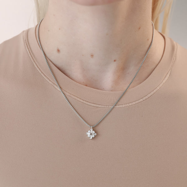 Model wearing the RHOMBUS ZIRCONIA NECKLACE which is made of 1mm wide Stainless steel chain with 18K gold plated sterling silver rhombus zirconia charm.