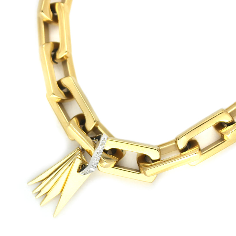 Light Bracelet which is 8 inches in length, Stainless steel 18k gold plated link chain with Triangle charms & Zirconia.