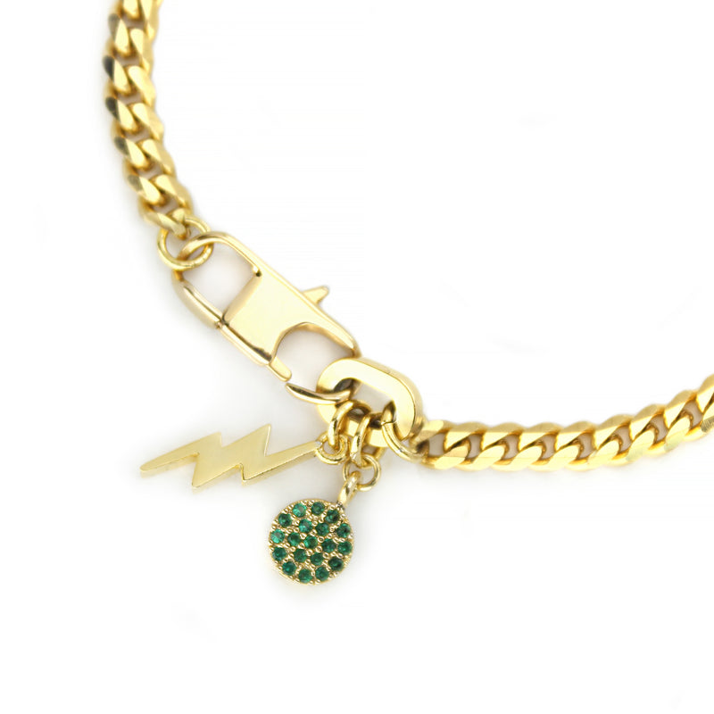 The ORZO BLENDED BRACELET is a 7" Stainless steel 18k gold plated chain bracelet with an 18k gold plated lightning charm and 18k gold plated and green zirconia charm.