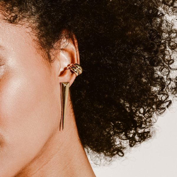Model wearing the SAVERS EAR CUFF which comes with two 18K gold plated copper ear cuffs, 0.5mm in width and the needle earring in gold.
