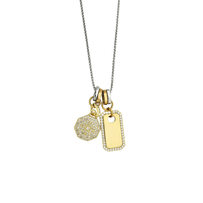 The TAG CHARM NECKLACE which is a 1mm wide, Stainless steel rhodium chain with Dainty gold filled North Star Burst Charm and tag charm.