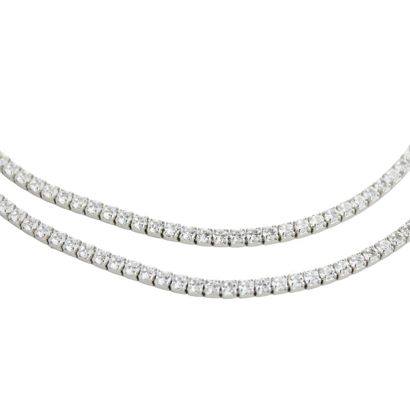 The THIN TENNIS NECKLACE SET which includes 14" and 15" tennis necklaces. Made of Rhodium-plated brass/cubic zirconia tennis necklace, 2 mm wide each.