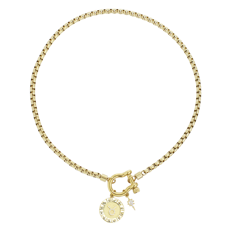 The Taurus Herradura Zodiac Necklace which is made of 18” Hypoallergenic Gold Plated Stainless Steel chain with 18K Gold Plated Horseshoe clasp and miniature star pendant and circular star sign micro pave Taurus constellation charm.