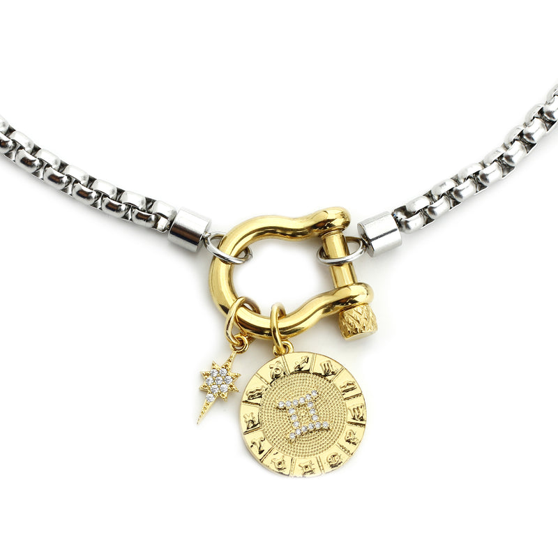 The Gemini Herradura Zodiac Necklace which is made of 18” Hypoallergenic Rhodium Plated Stainless Steel chain with 18K Gold Plated Horseshoe clasp and miniature star pendant and circular star sign micro pave Gemini constellation charm.