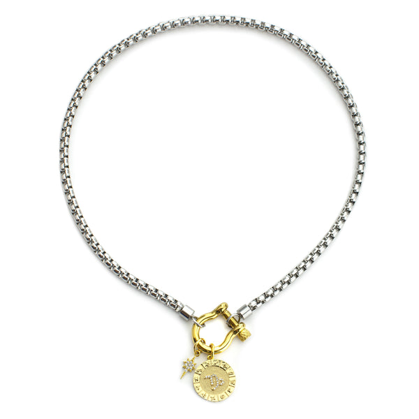 The Capricorn Herradura Zodiac Necklace which is made of 18” Hypoallergenic Rhodium Plated Stainless Steel chain with 18K Gold Plated Horseshoe clasp and miniature star pendant and circular star sign micro pave Capricorn constellation charm.
