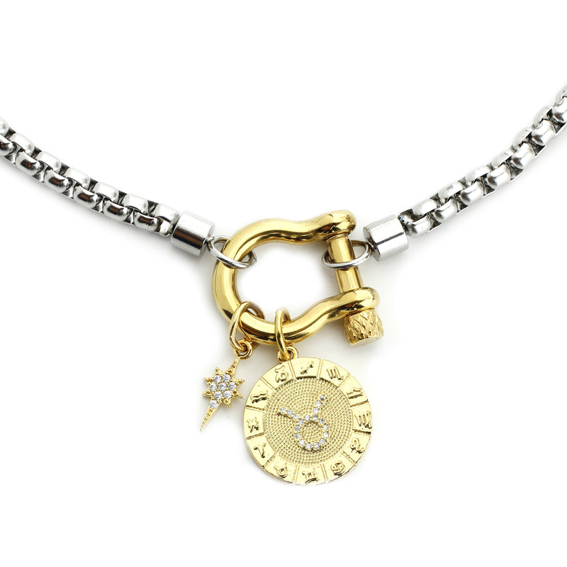 The Taurus Herradura Zodiac Necklace which is made of 18” Hypoallergenic Rhodium Plated Stainless Steel chain with 18K Gold Plated Horseshoe clasp and miniature star pendant and circular star sign micro pave Taurus constellation charm.