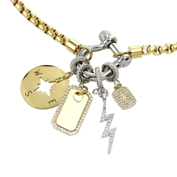 The Herradura Mix Necklace with gold chain and silver clasp. It comes with the celestial star, compass, lightning clip on and the PLAQUE CLIP ON CHARM which is made of Pave Clip on Stainless steel 18k gold plated pave plaque.