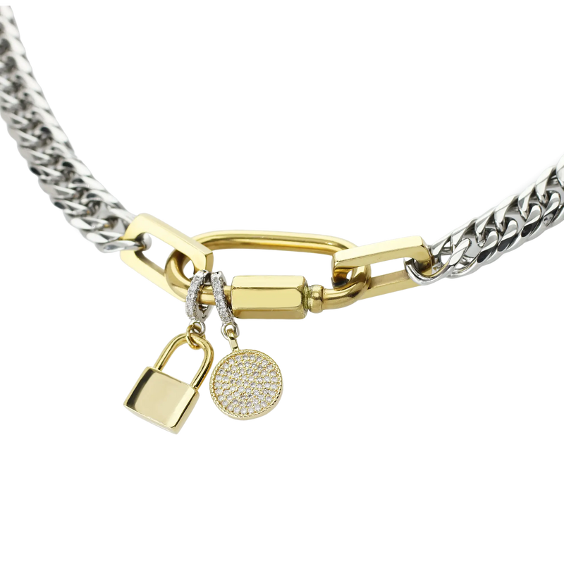 The Anne Charm Necklace with the circle and lock clip on charms which is made of a Pave clip on Stainless steel 18k gold plated lock charm around 32mm in length.