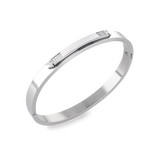 The Arrow Bangle, a silver bangle with diamond-like accents. ||| SILVER