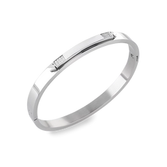 The Arrow Bangle, a silver bangle with diamond-like accents.