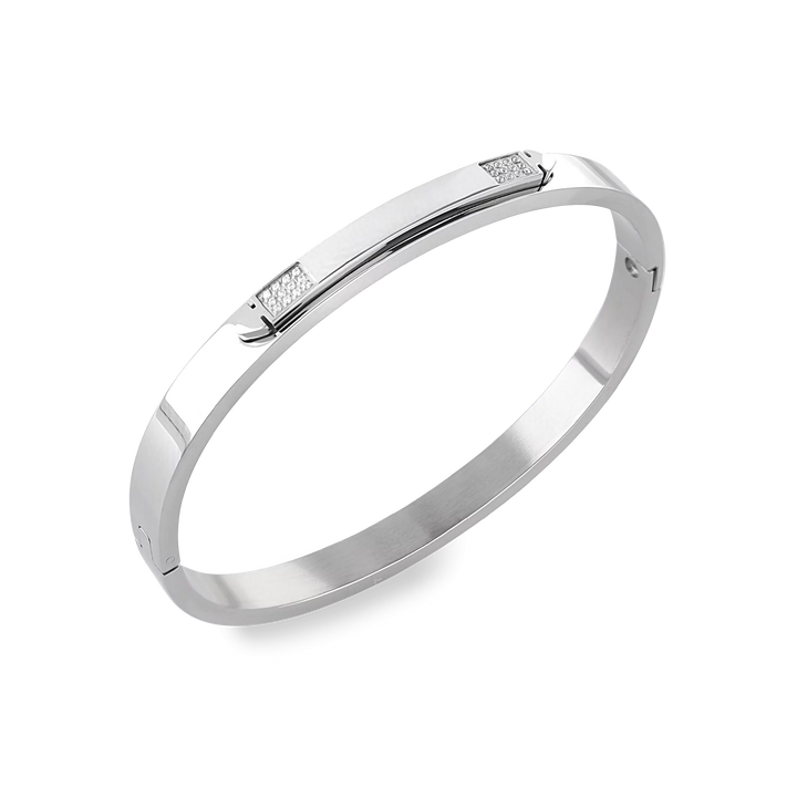 The Arrow Bangle, a silver bangle with diamond-like accents. ||| SILVER