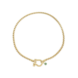 The Herradura Green Necklace, a single gold chain necklace featuring a bold clasp and a small green charm. This sleek and modern piece adds a touch of color and elegance, perfect for layering or wearing alone as a statement accessory.