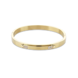 The Arrow Bangle, a gold bangle with diamond-like accents. ||| GOLD