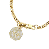 The **Corretto Blended Bracelet**, a gold-tone chain bracelet, features a stunning pavé compass pendant and a secure clasp, perfect for bold, everyday style.