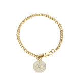 The Corretto Blended Bracelet, which is a single gold bracelet, features a classic chain design paired with a sparkling, compass-inspired charm pendant. This elegant piece combines timeless style with modern detailing, making it a versatile accessory perfect for stacking or wearing alone. The charm adds a touch of individuality, making it a meaningful addition to your jewelry collection.
