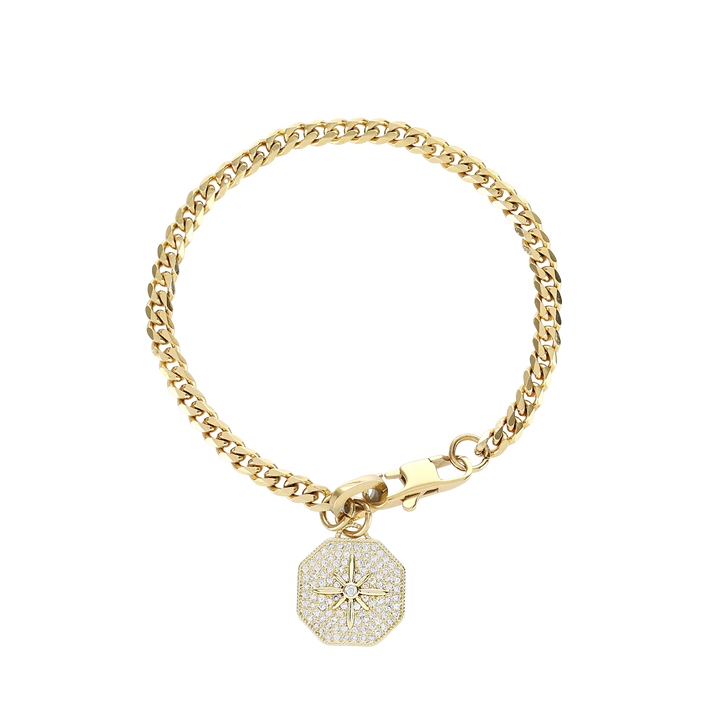 The Corretto Blended Bracelet, which is a single gold bracelet, features a classic chain design paired with a sparkling, compass-inspired charm pendant. This elegant piece combines timeless style with modern detailing, making it a versatile accessory perfect for stacking or wearing alone. The charm adds a touch of individuality, making it a meaningful addition to your jewelry collection.