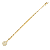 The Corretto Blended Bracelet, which is a single gold bracelet, features a classic chain design paired with a sparkling, compass-inspired charm pendant. This elegant piece combines timeless style with modern detailing, making it a versatile accessory perfect for stacking or wearing alone. The charm adds a touch of individuality, making it a meaningful addition to your jewelry collection.