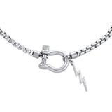 The Herradura Thunder Necklace - Silver, a single silver chain necklace featuring a bold clasp with a lightning bolt charm. This edgy and modern piece adds a touch of sparkle and attitude, perfect for making a statement or layering with other silver accessories.