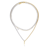 The Spike Trio Set, which is a three-piece layered necklace set featuring gold and silver chains with a mix of bold spike and charm pendants, offering a modern and edgy design perfect for versatile styling