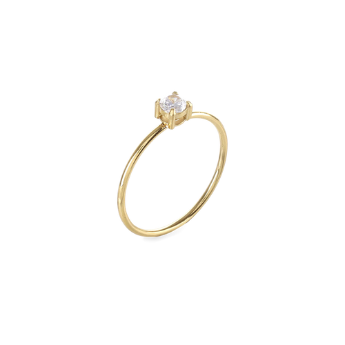 The Dainty Solitaire, which is a single-piece gold ring, features a delicate band topped with a sparkling solitaire stone in a prong setting, offering a timeless and elegant look for everyday wear or special occasions.