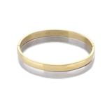 The Doble Plain Set which is a two-piece bracelet stack featuring one gold-toned and one silver-toned bangle with a sleek and minimalist design, perfect for mixing metals and elevating your everyday look.