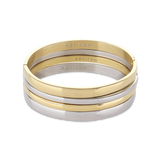 The Plain Medium Set, which is a multi-piece bracelet stack, features alternating gold and silver bangles with a sleek, polished finish, offering a chic and versatile design perfect for stacking together or wearing individually for a refined look.