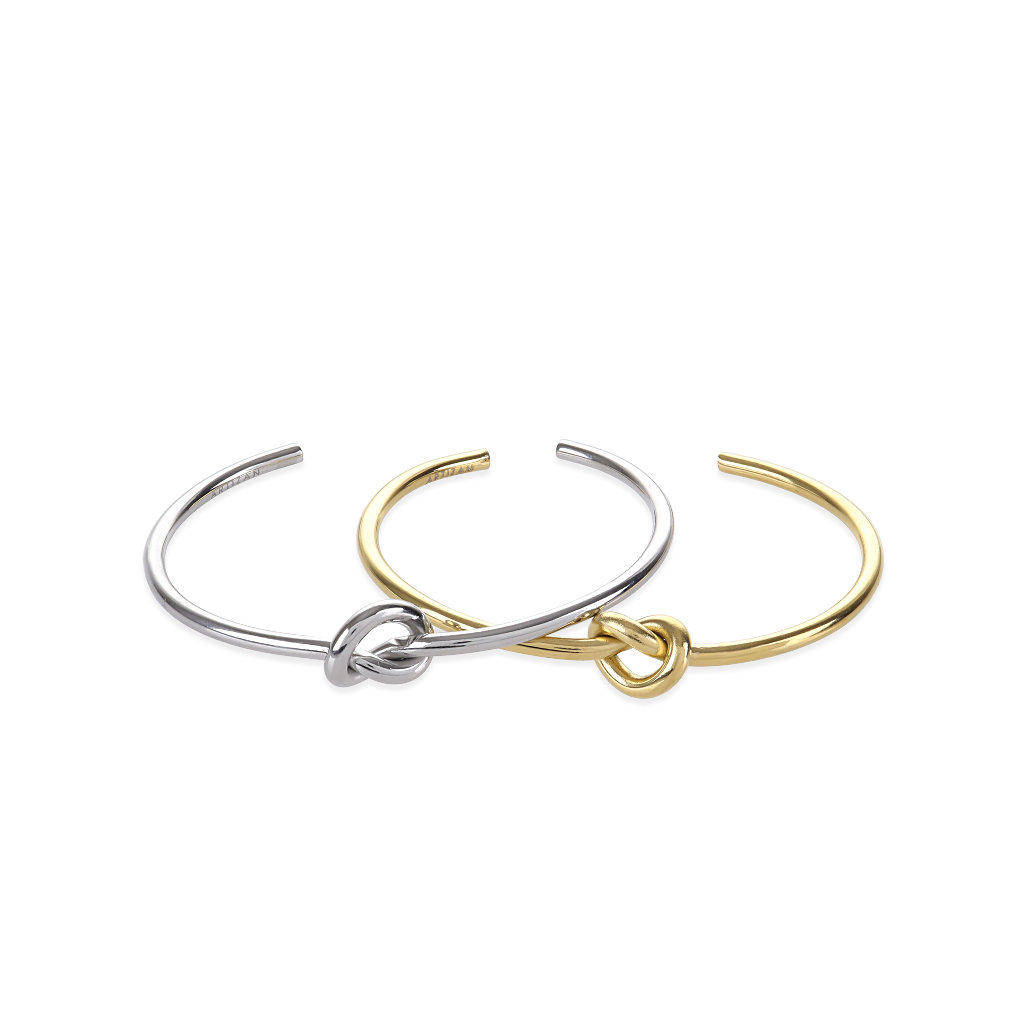 The Knot Bracelet, a sleek and minimalistic bangle available in gold and silver tones, featuring an elegant knot design at the center. This versatile piece can be worn alone or stacked with other bracelets for a refined, modern look that complements any style |||