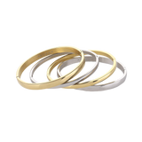 The Plain Medium Set, which is a multi-piece bracelet stack, features alternating gold and silver bangles with a sleek, polished finish, offering a chic and versatile design perfect for stacking together or wearing individually for a refined look.