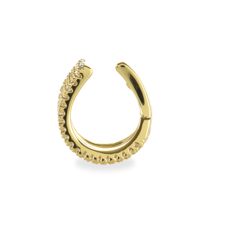 The Full Eternity Ear Cuff, which is a gold ear cuff, features intricate detailing for a sleek and modern accessory.