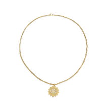 The I See Necklace, a luxurious gold chain with a  unique eye-shaped pendant adorned with sparkling diamonds.