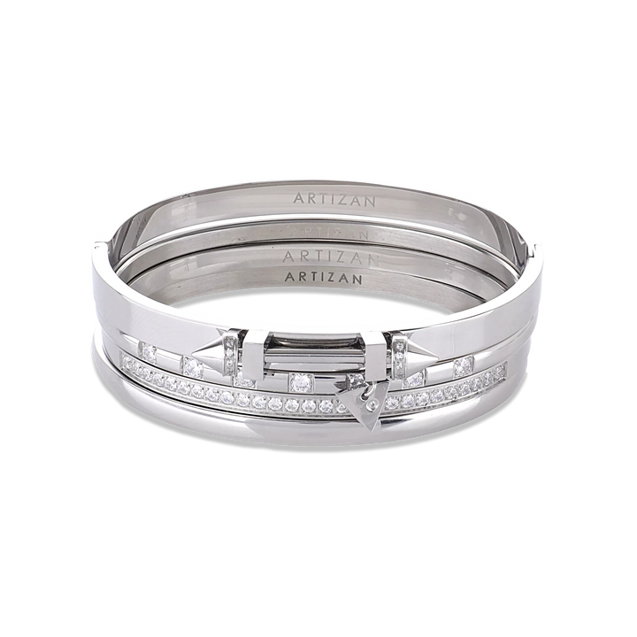 The ARROW STACK, a stunning silver bangle set featuring 4 bracelet stack with intricate arrowhead details and sparkling diamonds. 