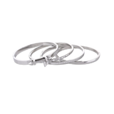 The ARROW STACK, a stunning silver bangle set featuring 4 bracelet stack with intricate arrowhead details and sparkling diamonds. 
