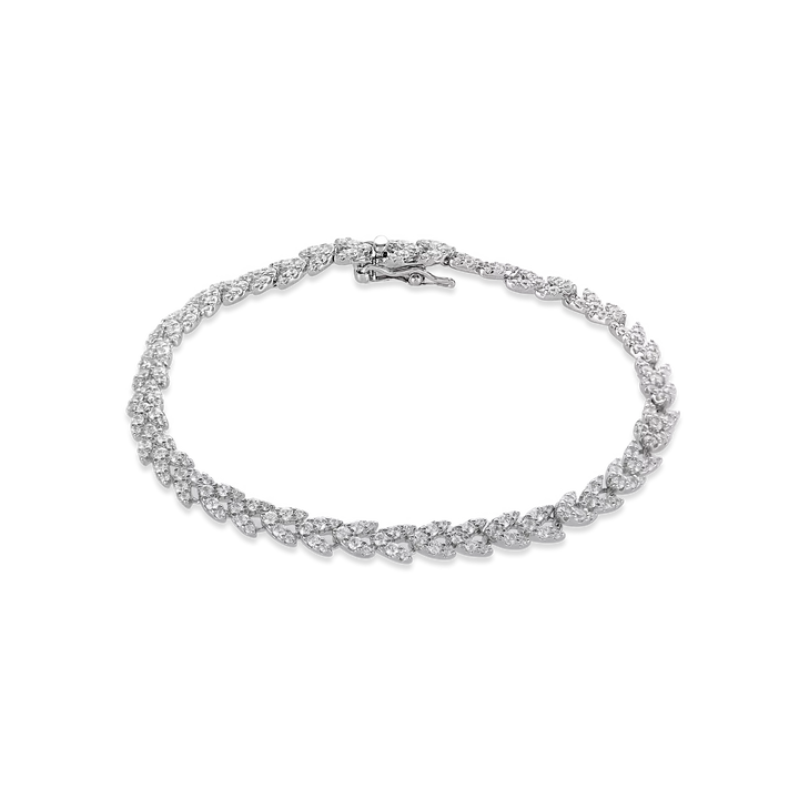 The Spiga Tennis Bracelet, a silver bracelet with a wheat link chain design and diamond-like stones.