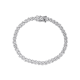 The Spiga Tennis Bracelet, a silver bracelet with a wheat link chain design and diamond-like stones.