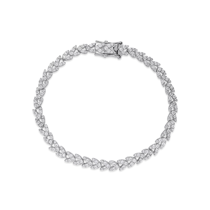 The Spiga Tennis Bracelet, a silver bracelet with a wheat link chain design and diamond-like stones.