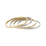The Plain Thin Set, which is a four-piece bracelet stack, features alternating gold and silver bands with a sleek and polished finish, offering a minimalist yet sophisticated look for versatile styling.