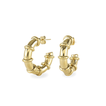 The Ringed-Up Bagel Hoops, a stunning pair of gold hoop earrings featuring a distinctive segmented design inspired by the shape of a bagel. 