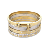 The Triangle Stack, a five-piece bangle set featuring gold and silver bangles with cubic zirconia accents and a triangle clasp detail.