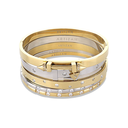 The Triangle Stack, a five-piece bangle set featuring gold and silver bangles with cubic zirconia accents and a triangle clasp detail.