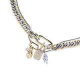 The JUST CLICK CHARM PARTY NECKLACE SET showcasing mixed metal chains in gold and silver, adorned with delicate charms, including a lock, teardrop pendant, and crystal accents, elegantly styled on a model's neck.
