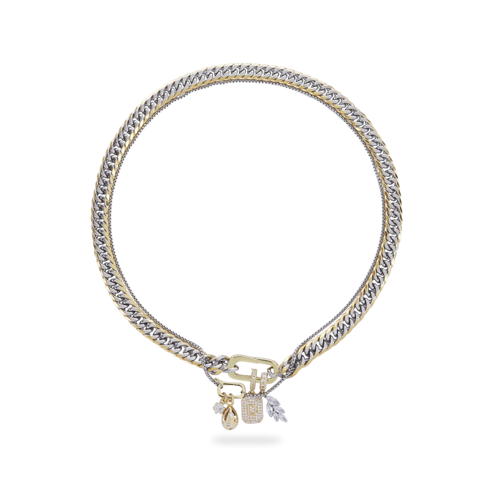 JUST CLICK CHARM PARTY NECKLACE SET featuring a bold mixed metal design with interwoven gold and silver chains, embellished with an elegant clasp and dangling charms including a teardrop, lock, and leaf accents."