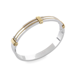 The MARINERO BANGLE, which is a single bangle in polished silver, features delicate parallel gold wires along its top, adding a refined, nautical-inspired detail. This two-tone design by Artizan is elegant and versatile, making it ideal for both everyday wear and special occasions. ||| SILVER






