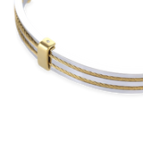The MARINERO BANGLE, which is a single bangle in polished silver, features delicate parallel gold wires along its top, adding a refined, nautical-inspired detail. This two-tone design by Artizan is elegant and versatile, making it ideal for both everyday wear and special occasions. ||| SILVER






