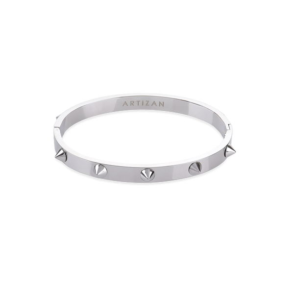 The Spikes Bangle in silver, a silver bangle with spike accents.