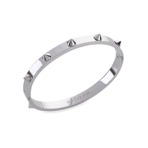 The Spikes Bangle in silver, a silver bangle with spike accents.