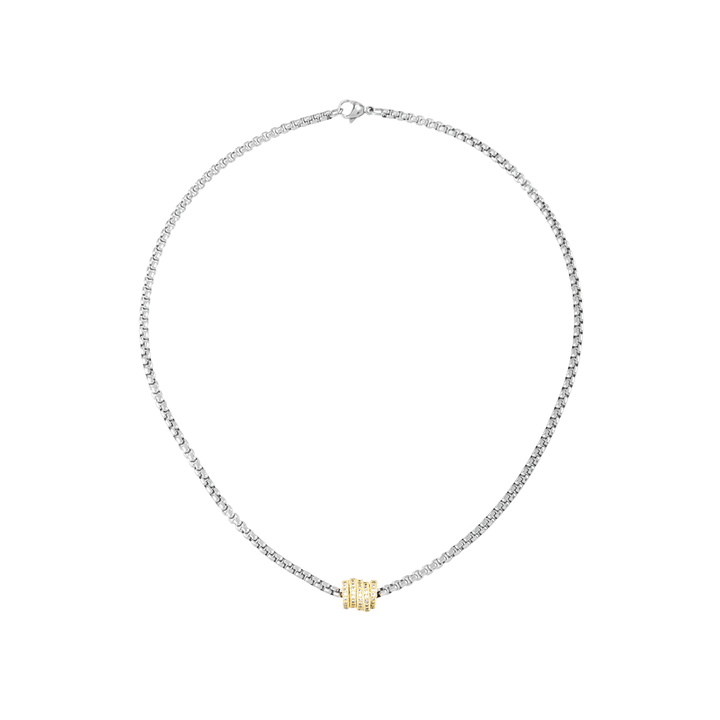 The Nut Necklace, a silver box chain with a gold nut-shaped pendant encrusted with stones. ||| MIX