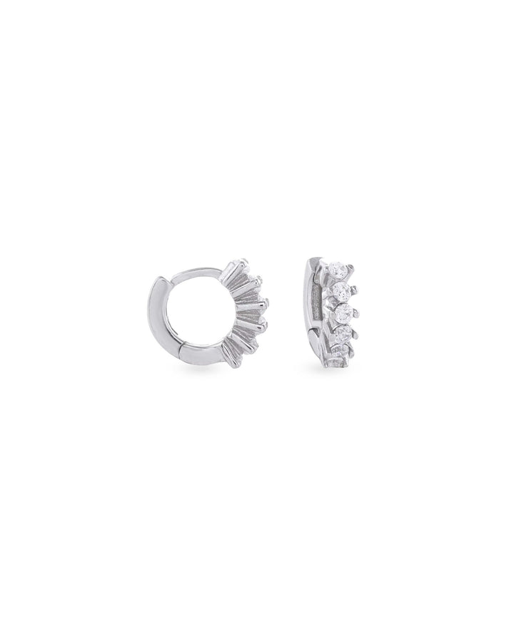 The Tiny Huggies Hoop, a pair of small silver hoop earrings that feature a row of sparkling cubic zirconia stones set in a  pointed, triangular pattern. ||| SILVER/5mm