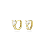 The One Stone Gold Piercing Hoops, which are a pair of gold hoop earrings, feature a central heart-shaped stone with additional sparkling accents along the band.