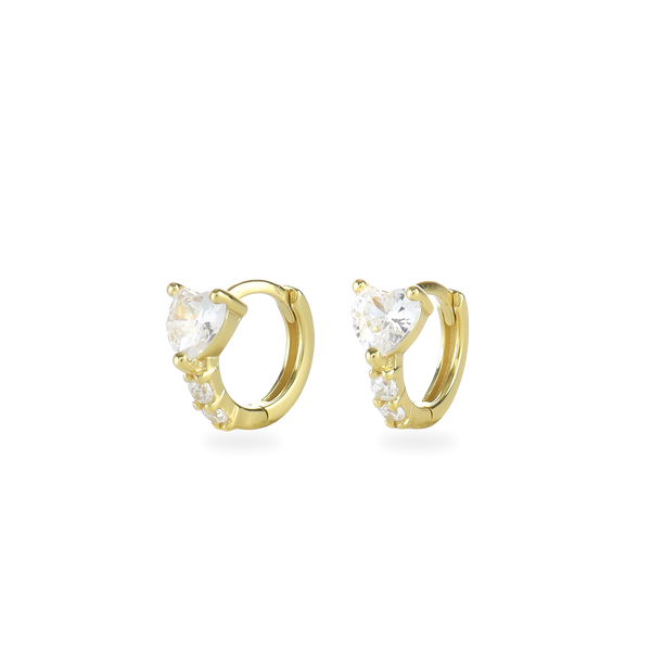 The One Stone Gold Piercing Hoops, which are a pair of gold hoop earrings, feature a central heart-shaped stone with additional sparkling accents along the band.